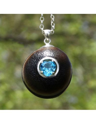Blue topaz necklace with mucuna seed
